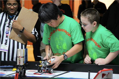 Green team sets robot up to compete in performance Green team sets robot up to compete in performance